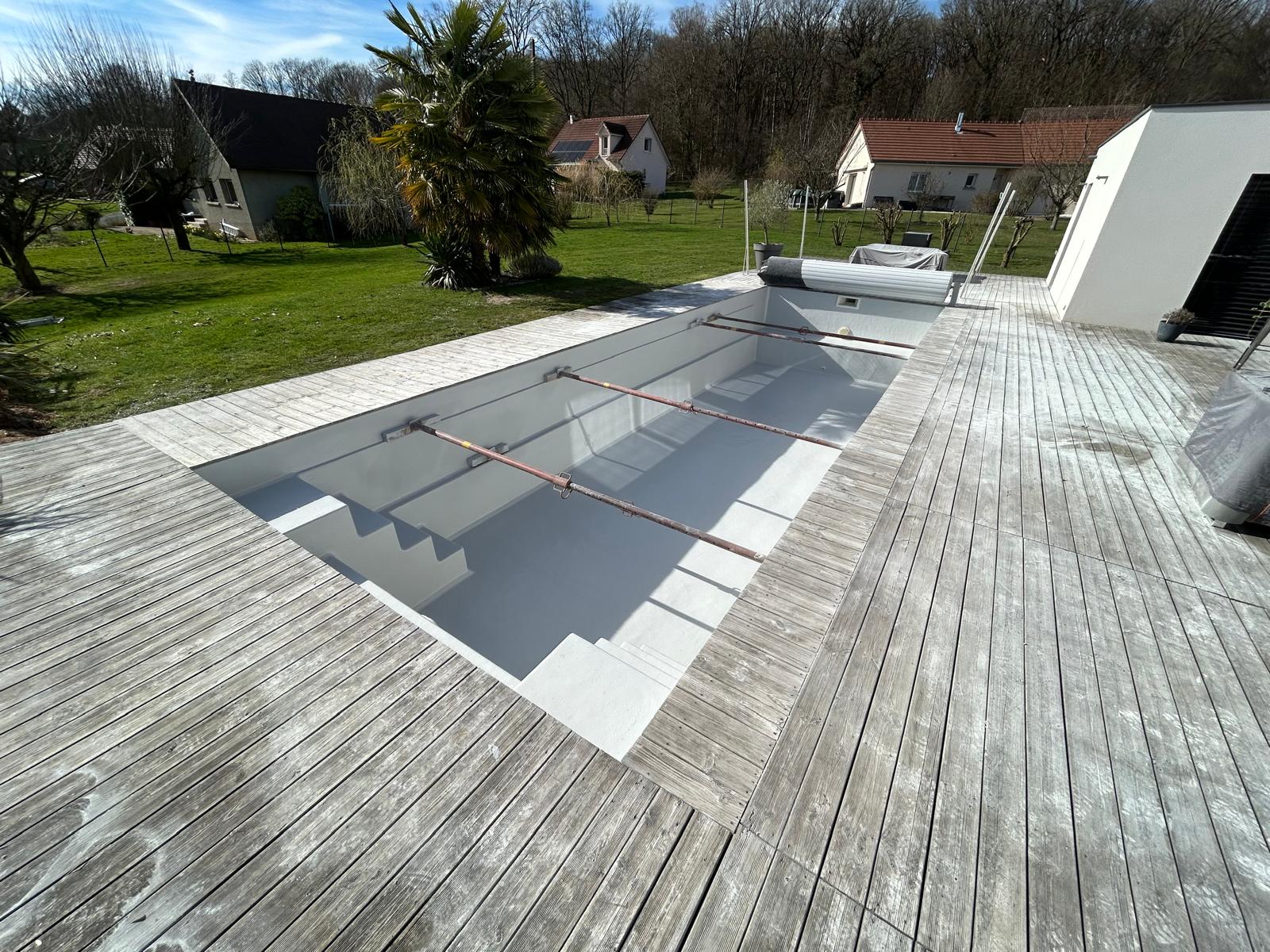 Pool renovation set in a timber deck terrace — aerial perspective